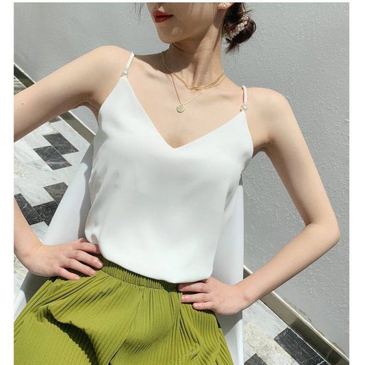 Chic white camisole is a versatile wardrobe staple