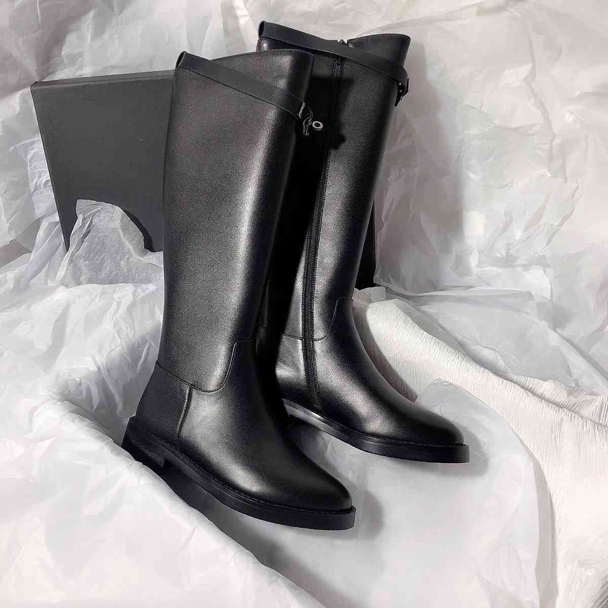 Black leather knee-high riding boots